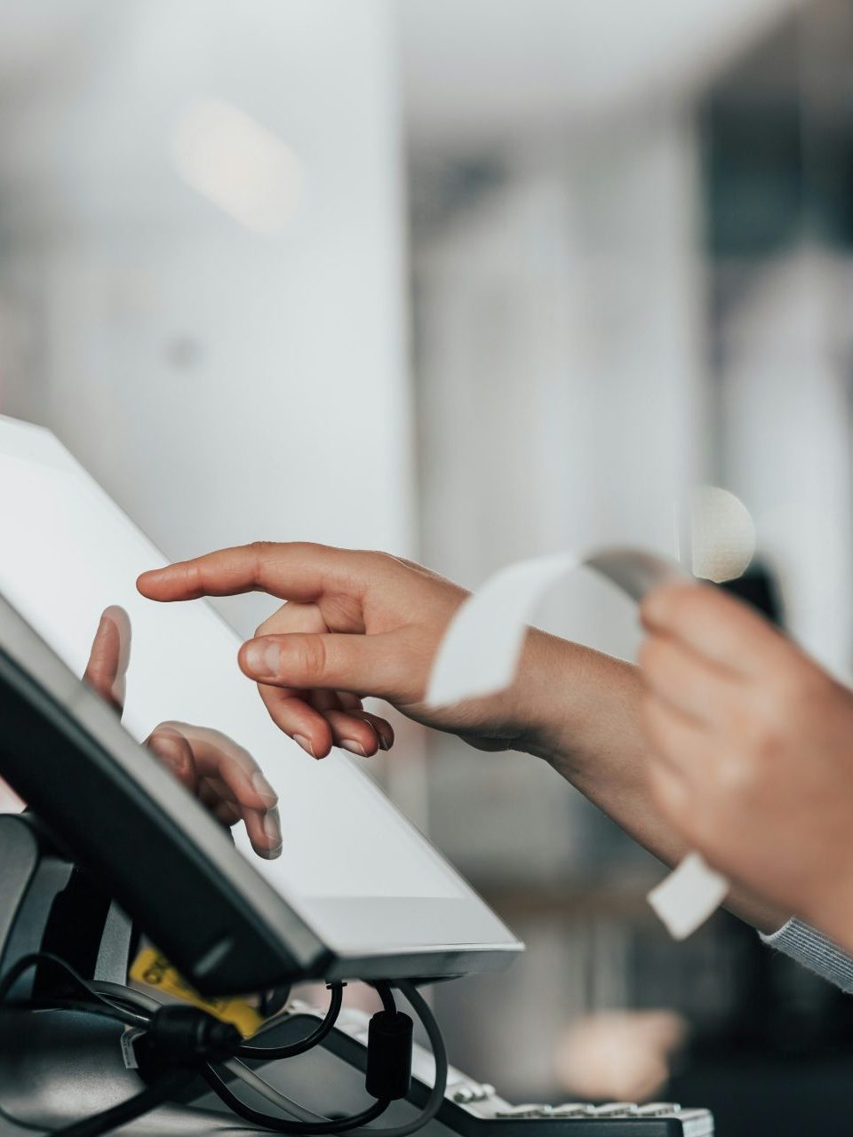 a person is using a pos machine in a store